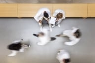 Scientists walking in the corridor from above