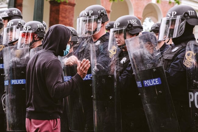 Protesters face off against police on the UVA campus.