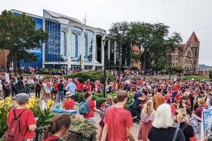 West Virginia University students, many wearing red, protesting outside the Mountainlair.